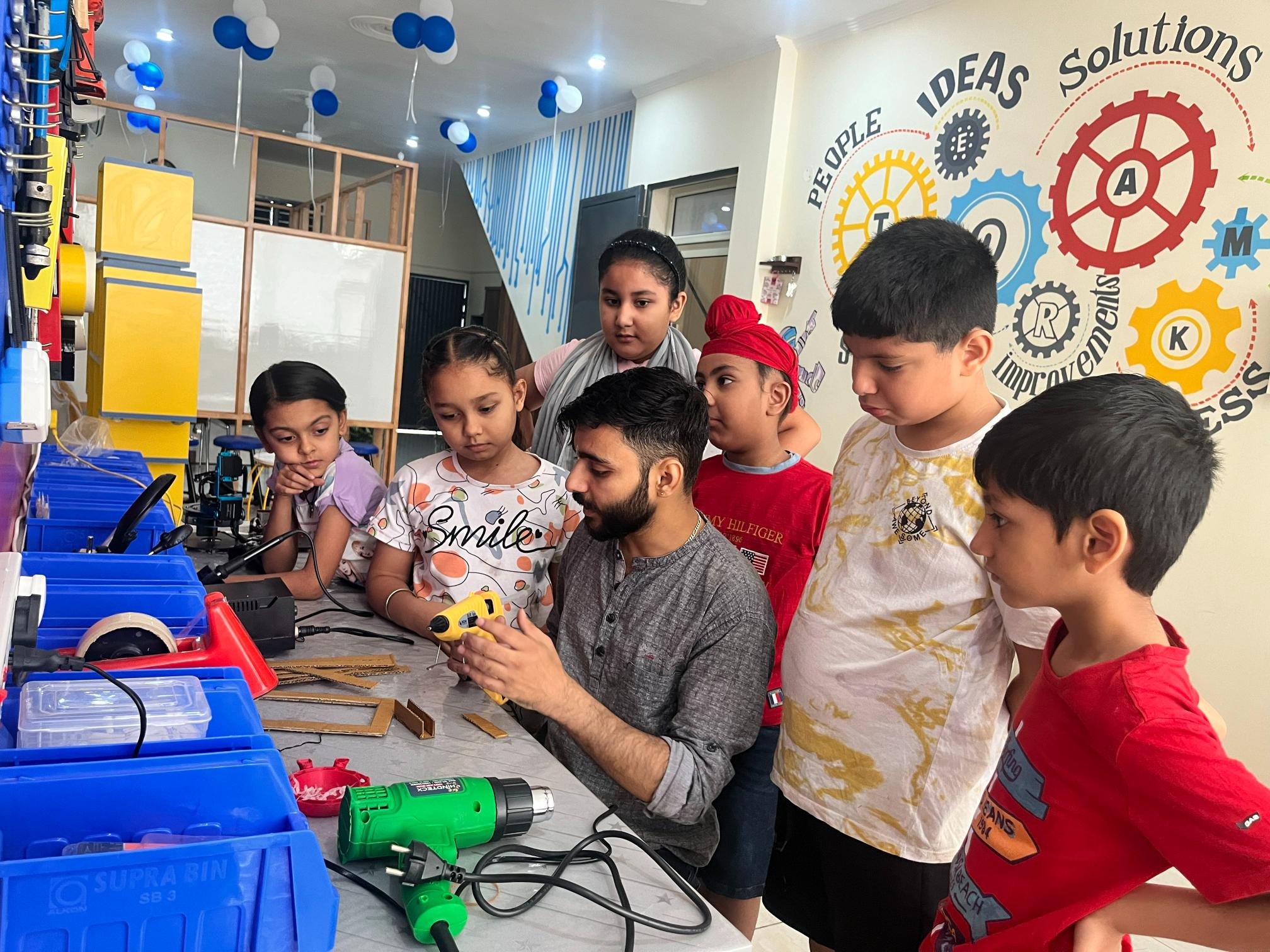 Student showcasing a finished STEM project